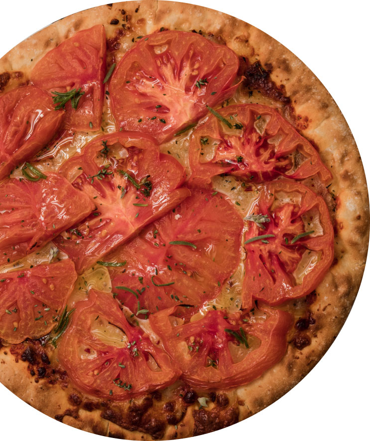 Imagen de una pizza vista desde arriba hecha con tomates Monterosa. Muy apetecible.